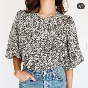 Black and cream blouse with dainty floral print and flowy sleeves